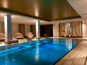 Sunny Suite 14 - elegantes Hotelapartment mit großem Pool-Wellnesbereich und seitlichem Meerblick Börgerende-Rethwisch